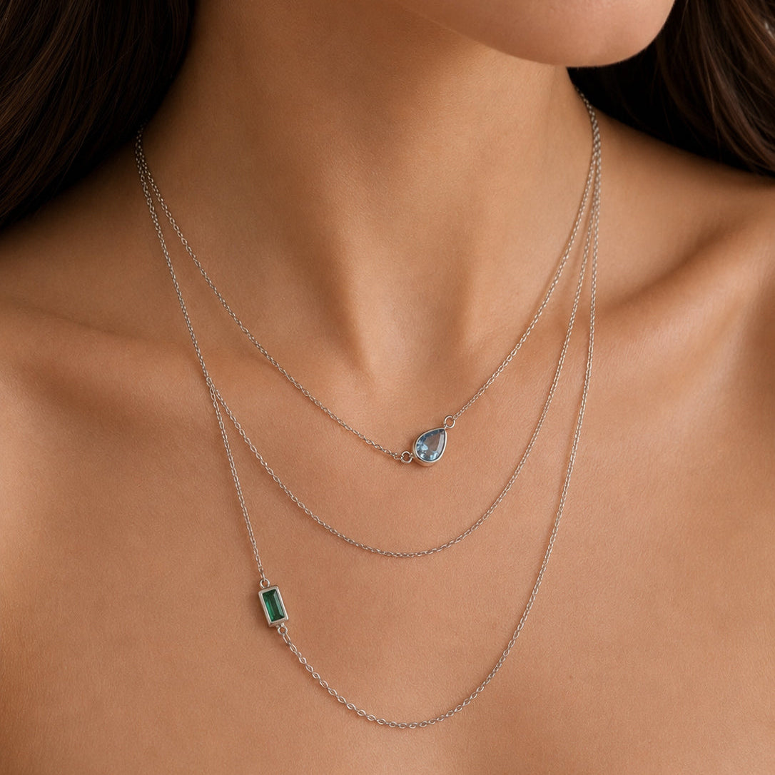 Bonheur Jewelry Ambroise 3 Strand Necklace, gold/rhodium finish, green crystal, necklace, styled view.