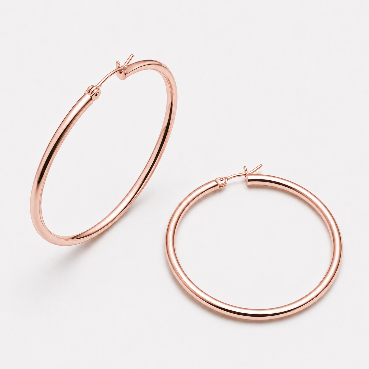 Bonheur Jewelry Margot Lightweight Hoops, gold, rose gold, or rhodium finish, polished metal, hoop earrings, side view.