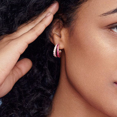 Bonheur Jewelry Mariah Pink Hoop Earrings, gold/rhodium finish, pink Swarovski crystal hoop earrings, styled view.