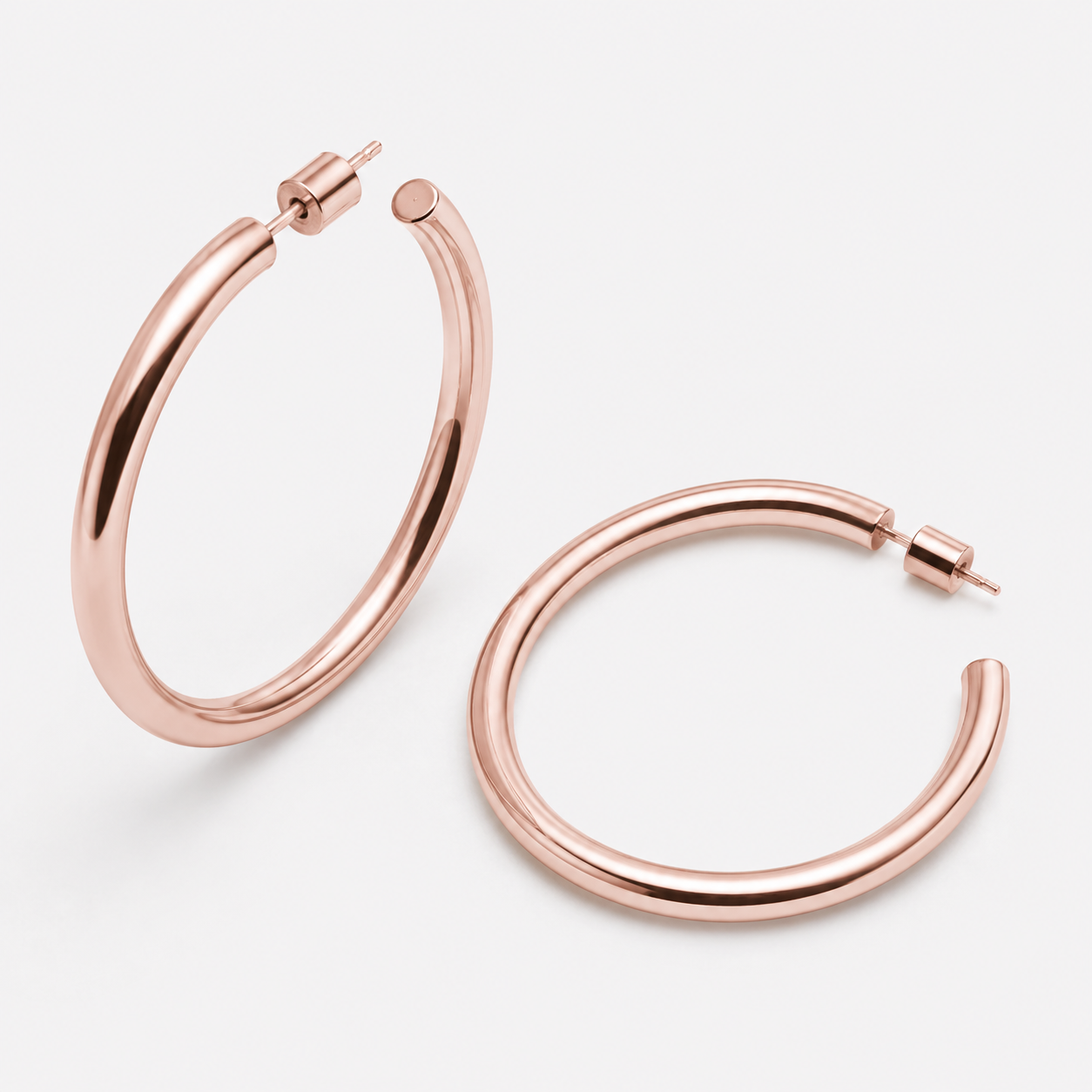 Bonheur Jewelry Madison Tube Hoops, gold, rose gold, or rhodium finish, polished metal, hoop earrings, front view.