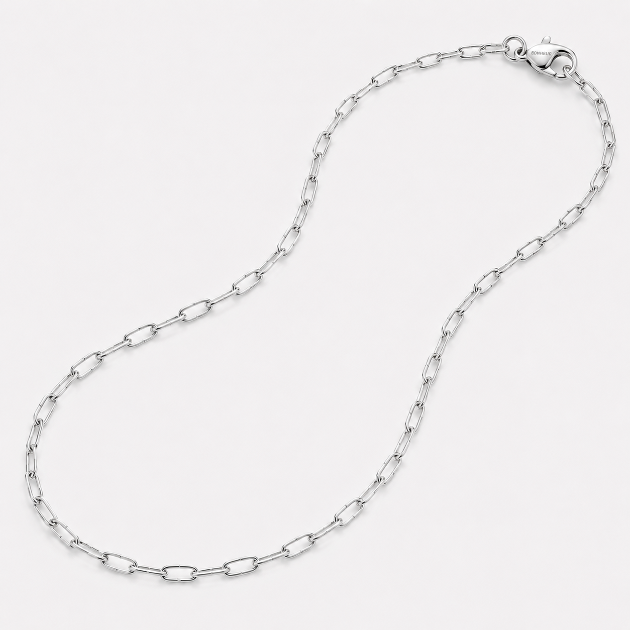 Bonheur Jewelry Dalila Silver Chain Link Necklace, rhodium plated finish, polished metal, necklace, styled view.
