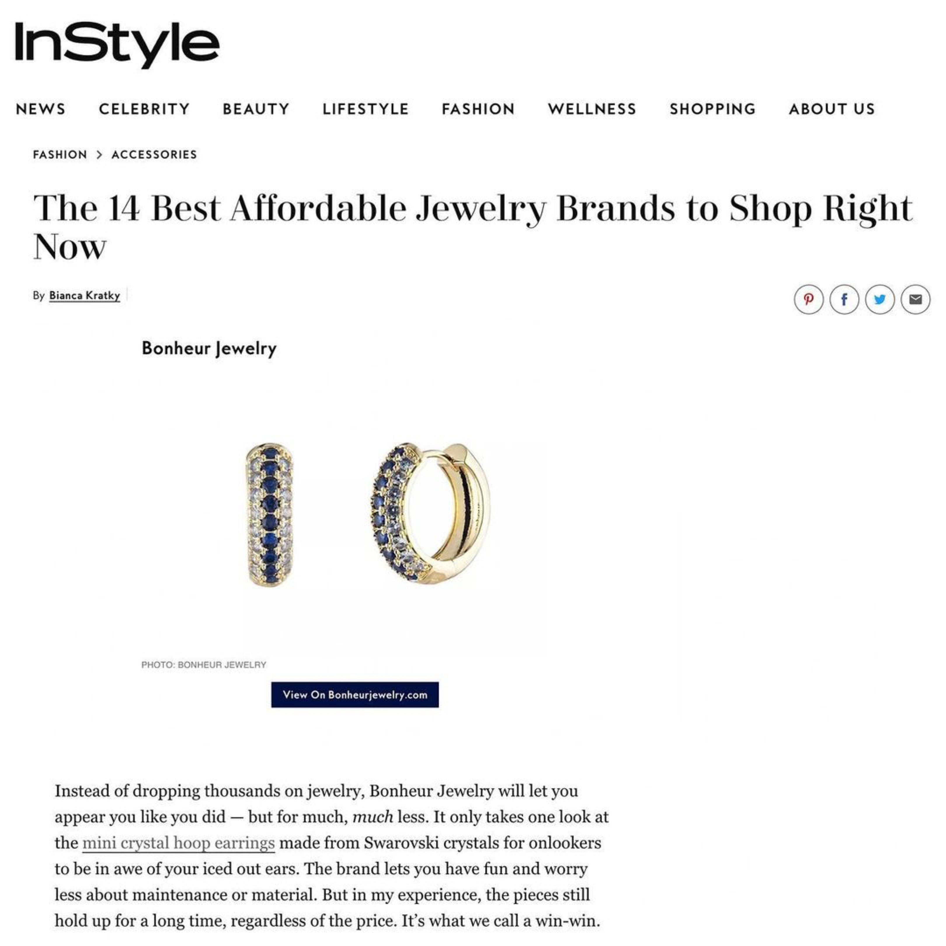 Bonheur Jewelry Addison Pave Huggie Hoop Earrings, gold/rhodium finish, blue crystal, hoop earrings, side view.