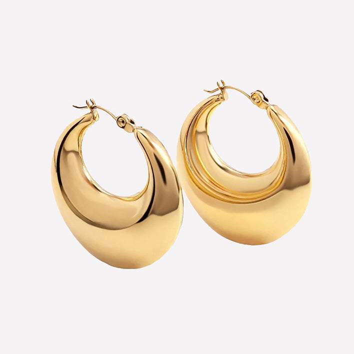 Bonheur Jewelry Daphné Extra Large Puffy Hoops, gold or rhodium finish, crystal, hoop earrings, front view.