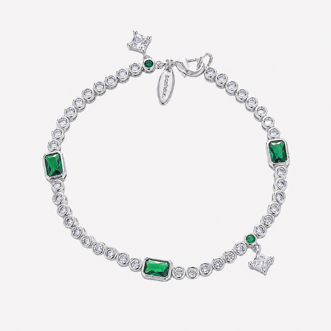 Bonheur Jewelry Eugenié Bezel Tennis Bracelet in gold or rhodium finish with white and green Swarovski crystals, front view.