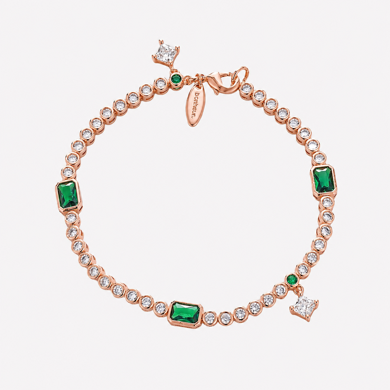 Bonheur Jewelry Eugenié Bezel Tennis Bracelet in gold or rhodium finish with white and green Swarovski crystals, front view.