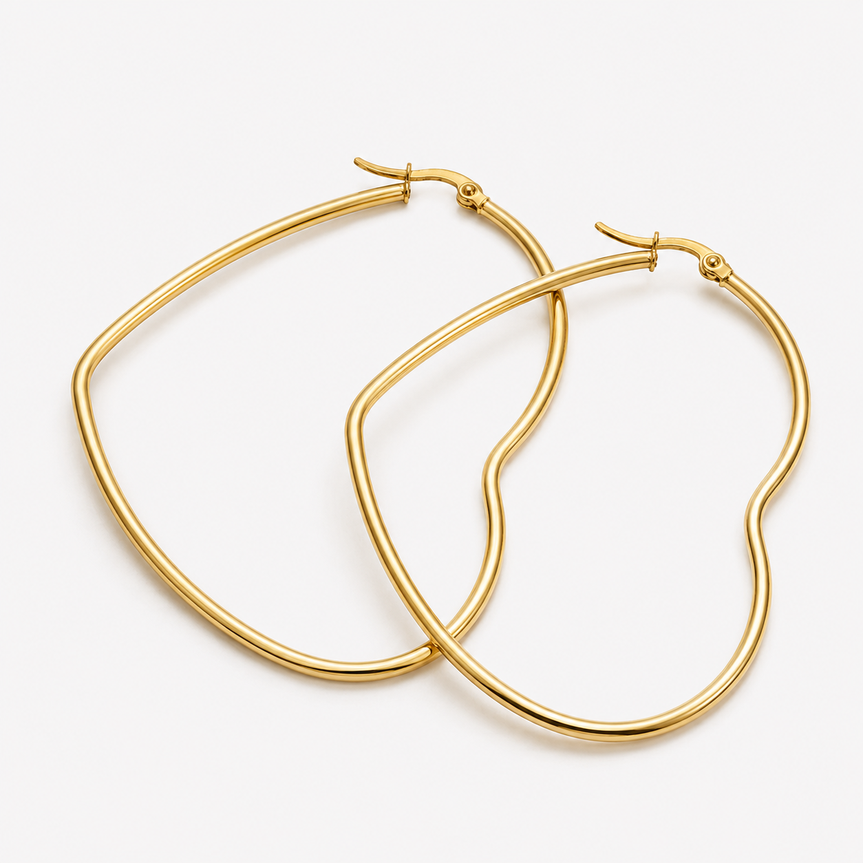 Selby Heart Hoop Earrings by Bonheur Jewelry in polished gold, rose gold, or rhodium finish, styled front view.