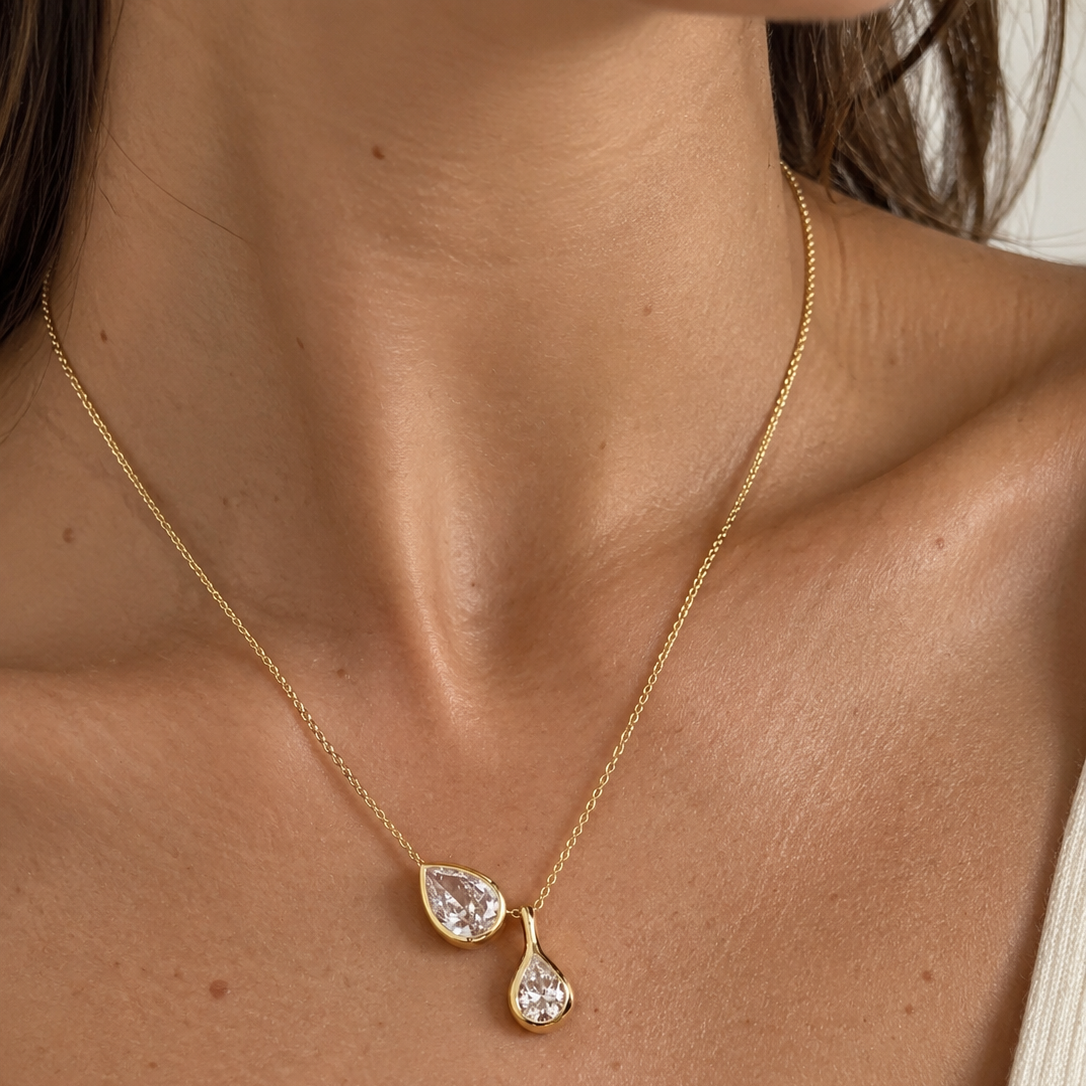 Bonheur Jewelry Bernadette Pear Shaped Necklace in rhodium plated silver with pear Swarovski crystal, front view.
