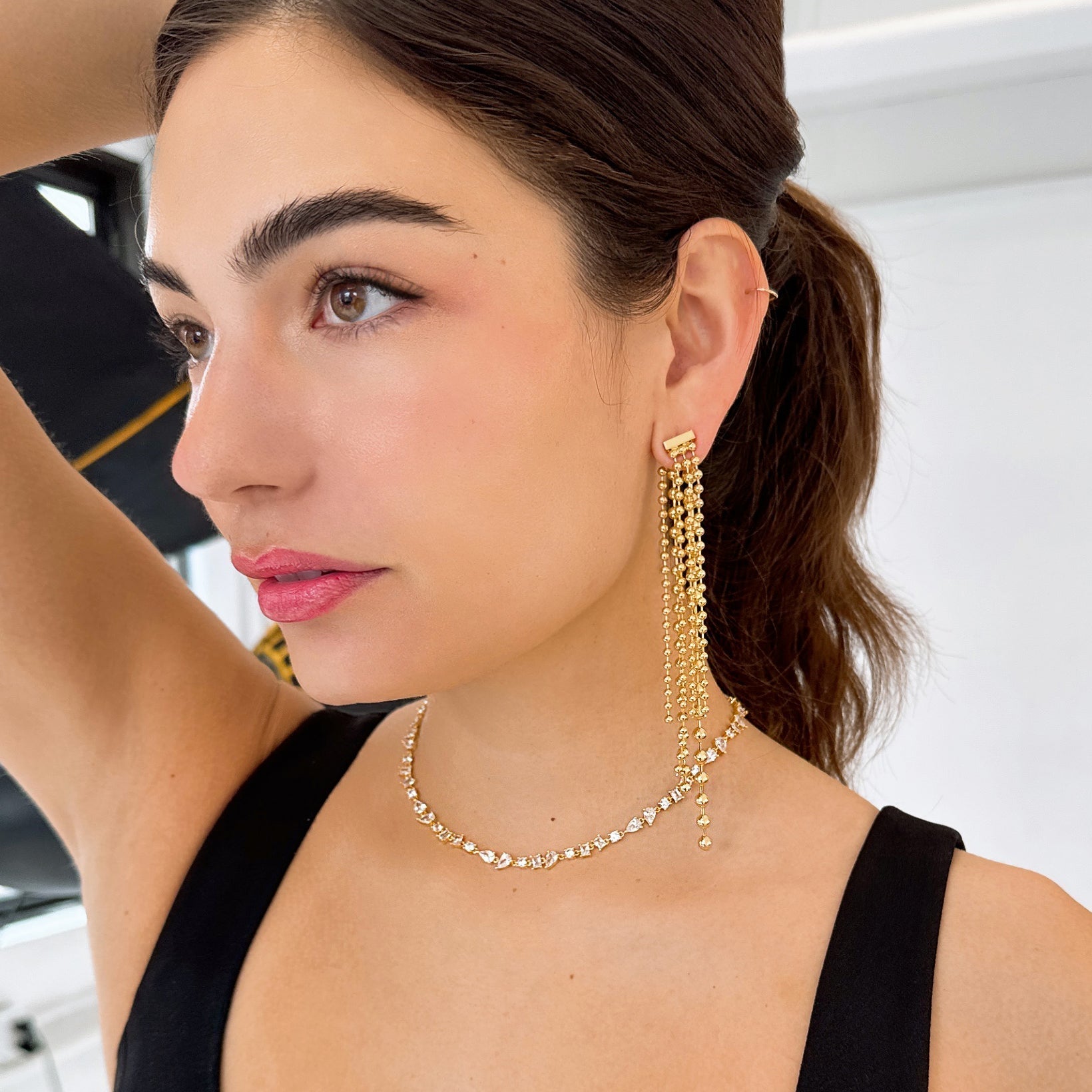 Bonheur Jewelry Taylor Long Beaded Earrings, long beaded earrings with hollow sphere detail and ear jacket styling, side view.